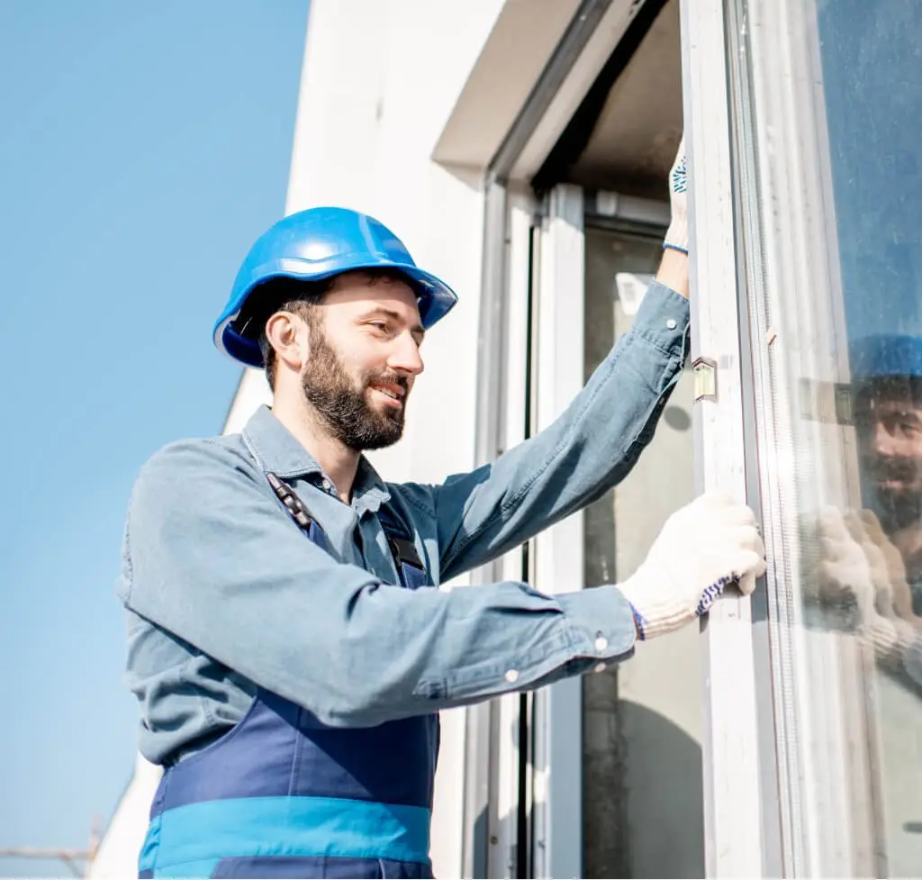 Installer mounting a window